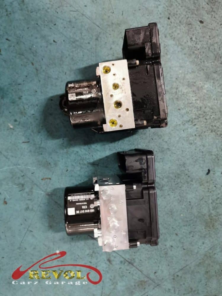 The failed ABS pump removed, the brand new replacement ready to fit.