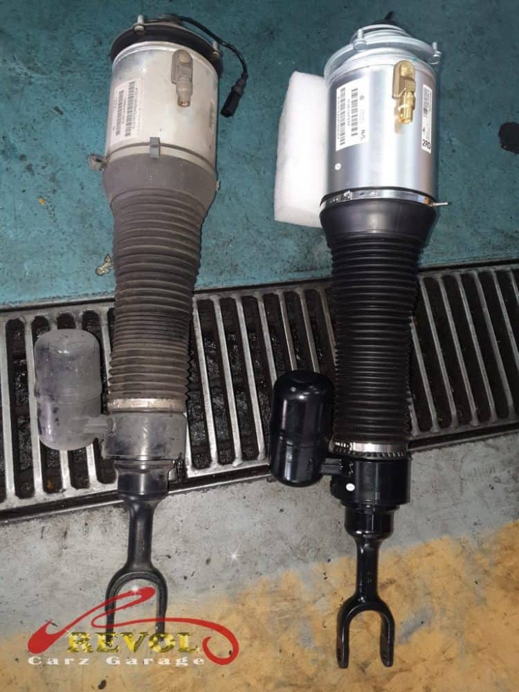 The Volkswagen Phaeton sitting lopsided, the failing driver's-side air strut found leaking.