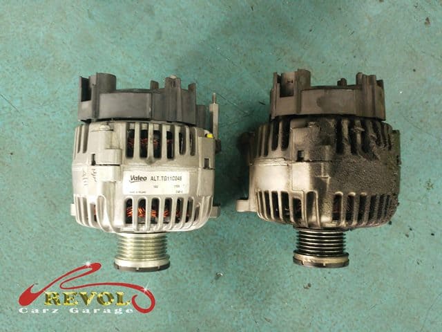 The brand new alternator on the left, the oil-soaked failed one on the right to be discarded.