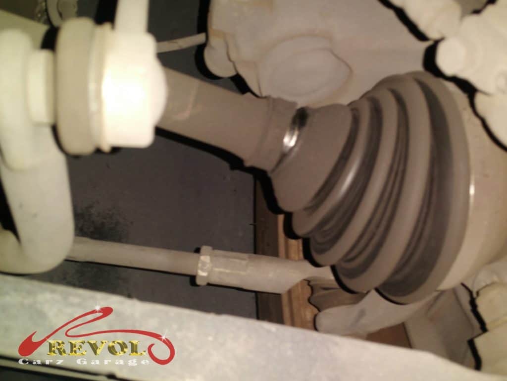 The worn driveshaft identified as the noisy culprit.