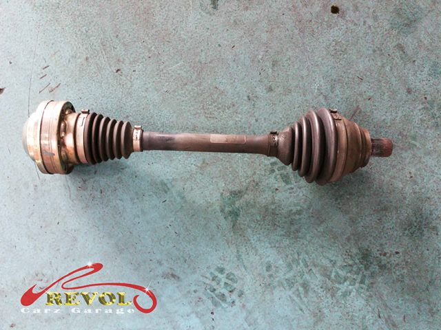 The failed driveshaft removed from the front of the car.