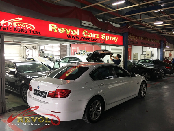Revol Carz Spray storefront with white BMW after spray painting