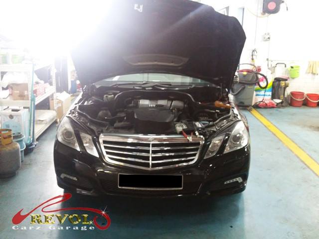 Revol Carz Garage interior with Mercedes-Benz being worked on
