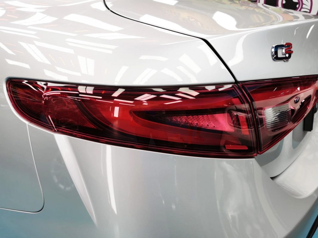 The coated bonnet of the Alfa Romeo Giulia Veloce under workshop lighting.