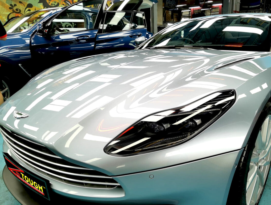 The Aston Martin DB11 from a side angle after the titanium coating.