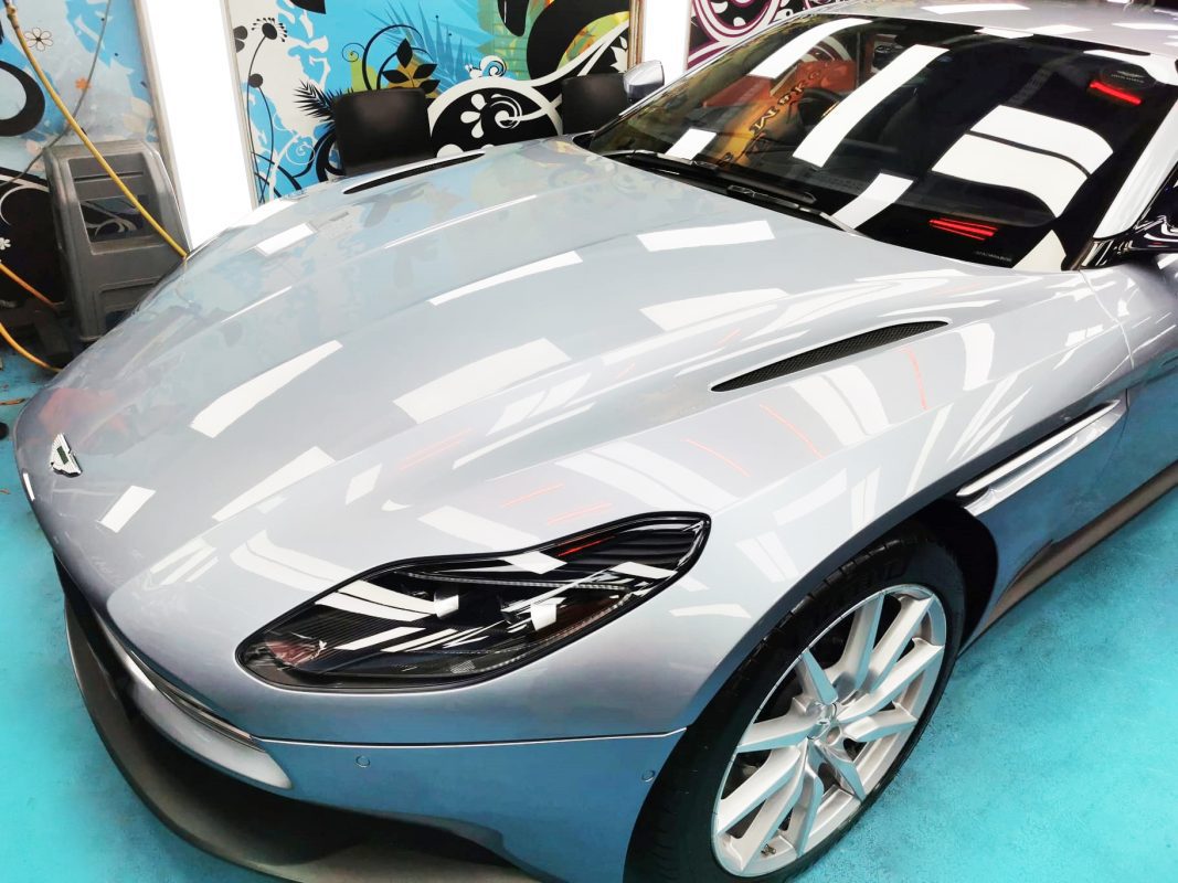 The Aston Martin DB11 V8 from a side angle after the ceramic coating.