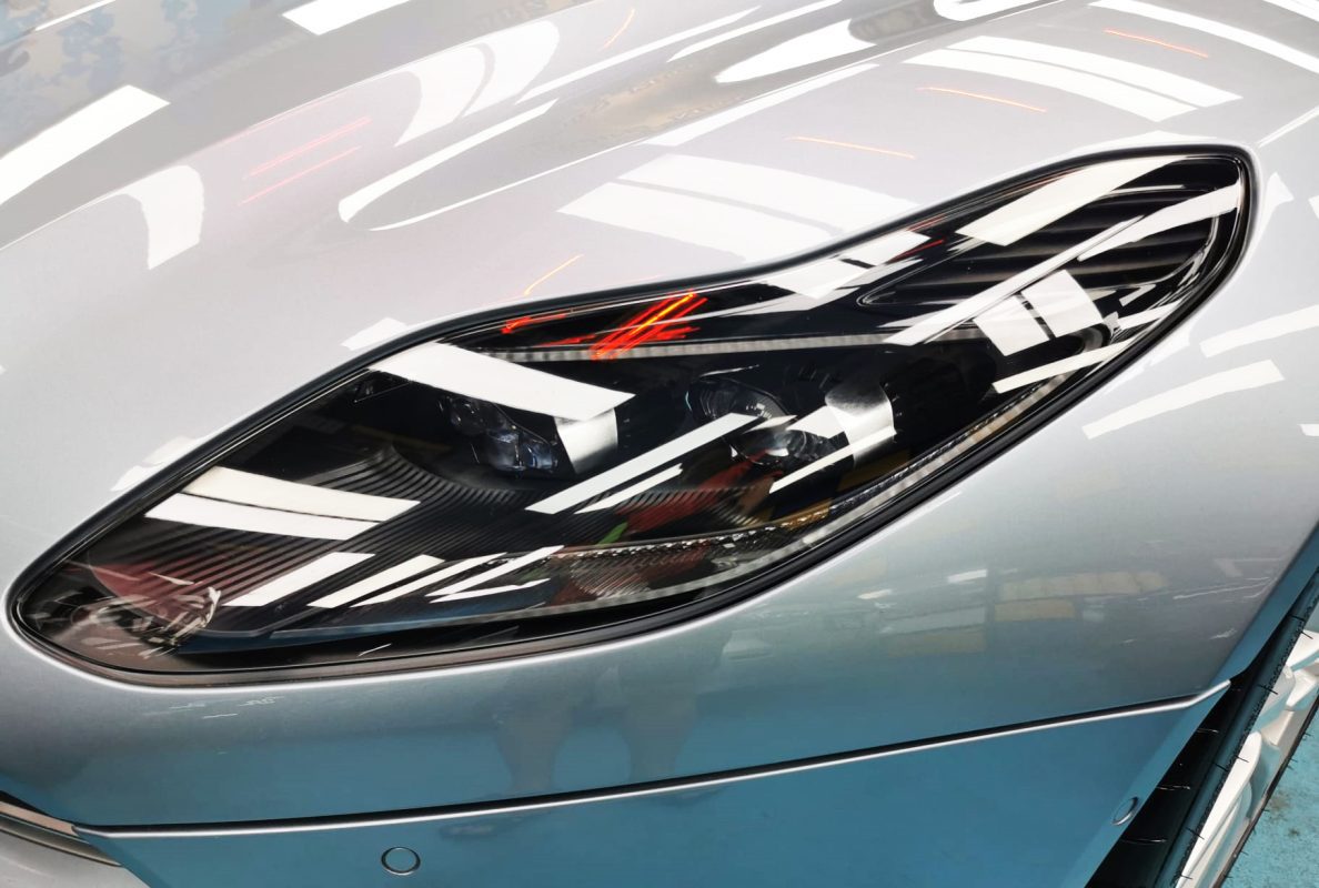 The DB11 V8's coated paintwork showing clean reflections.