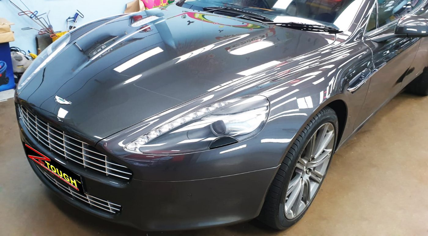 The Aston Martin Rapide from a side angle after the ceramic coating.