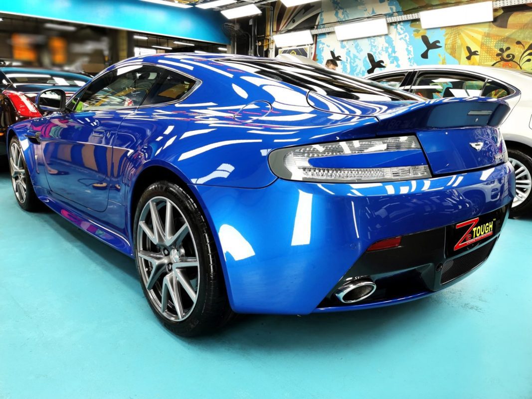 Rear quarter of the Aston Martin V8, glossy and protected.