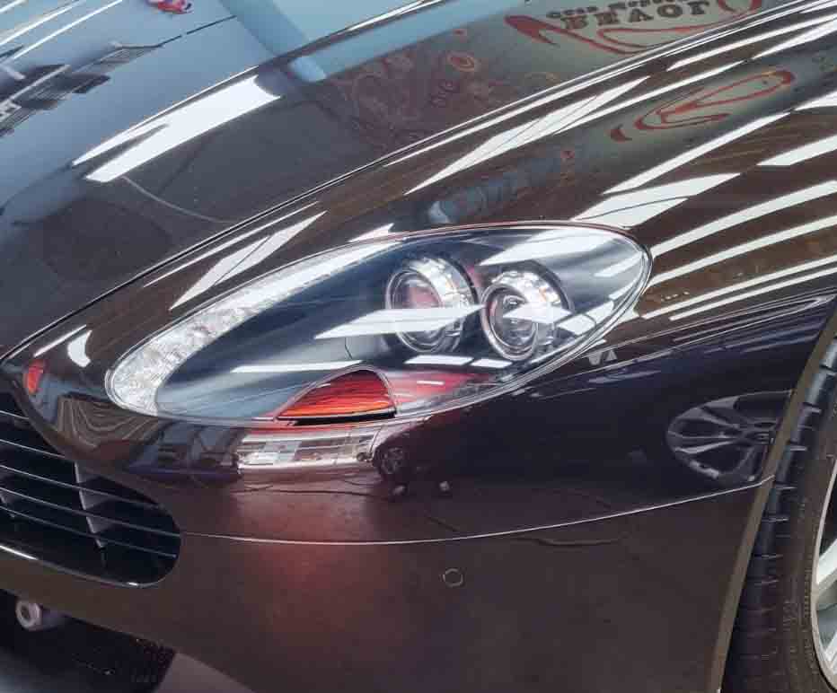 The V8 Vantage's coated paintwork showing clean reflections.