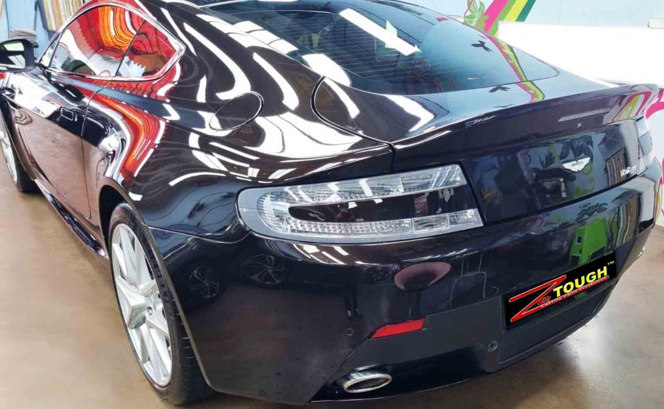 Rear quarter of the Aston Martin V8 Vantage, glossy and protected.