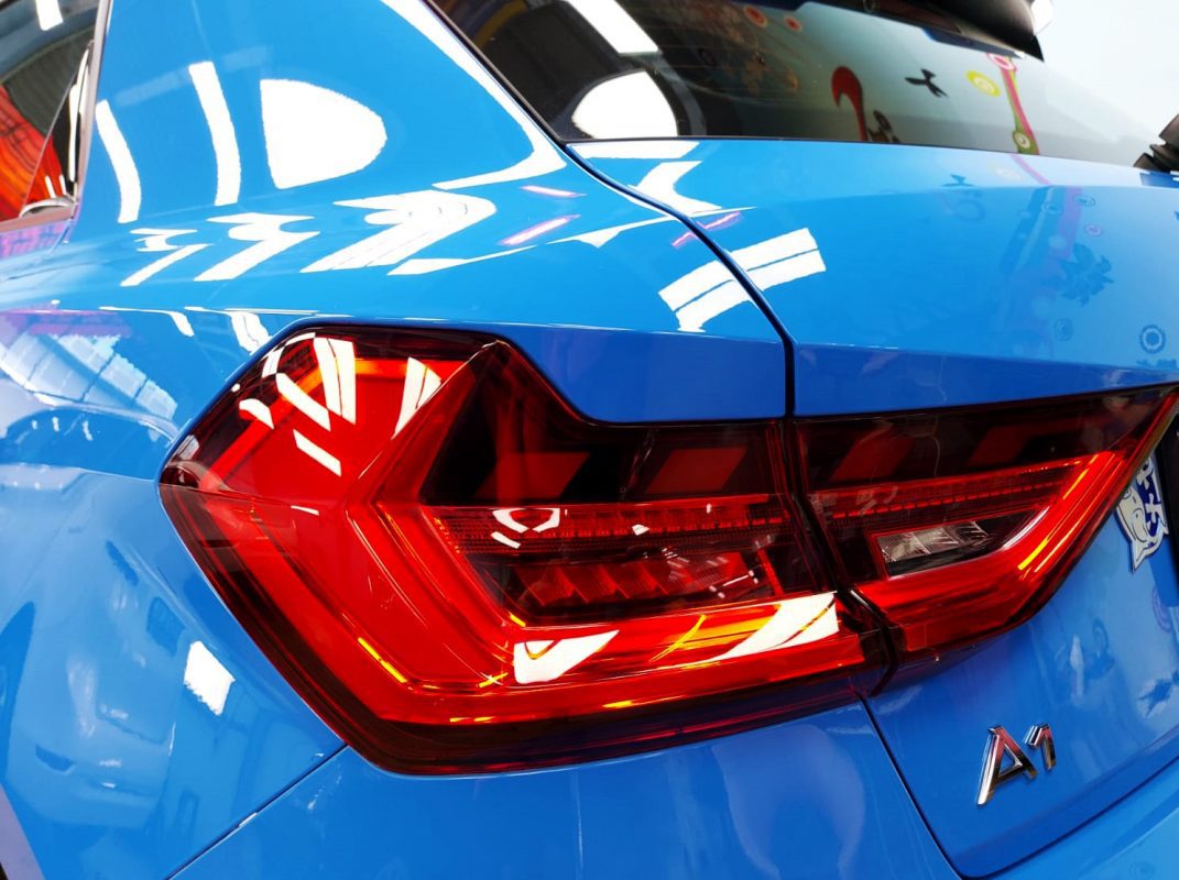 The coated bonnet of the A1 under workshop lighting.