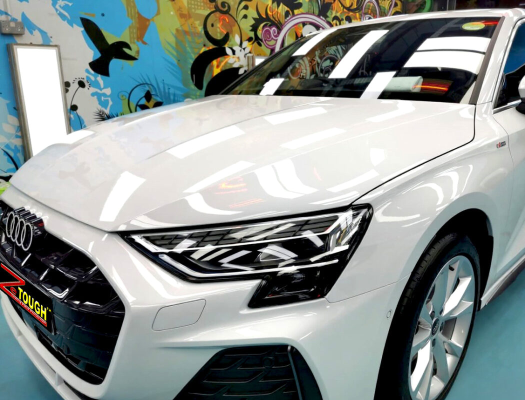 The Audi A3's coated paintwork under workshop lighting.