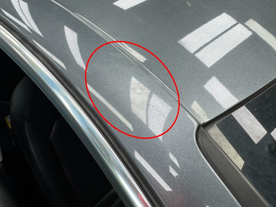 The Audi A3 from another angle at intake, showing the damaged paintwork.