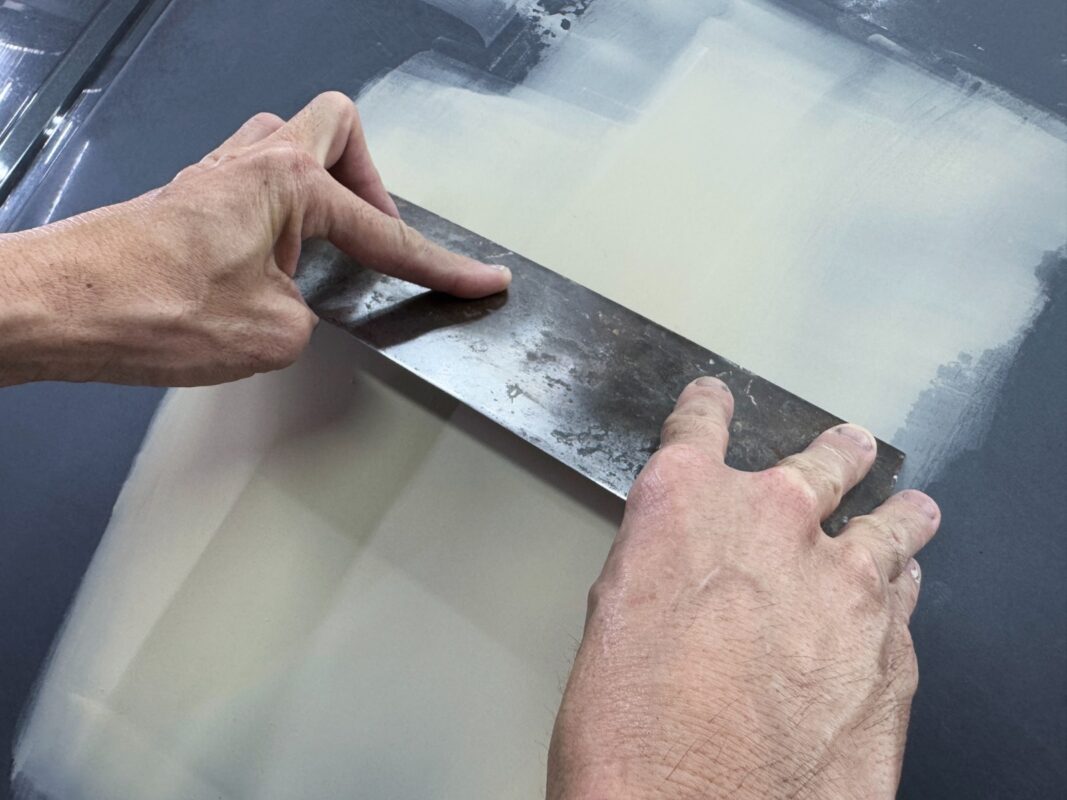 The body surface being inspected for scratches and dents.