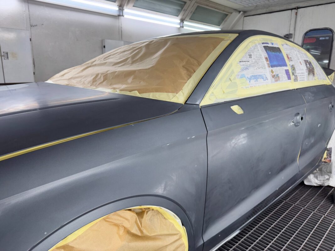 Non-painted surfaces being masked off on the Audi A3.