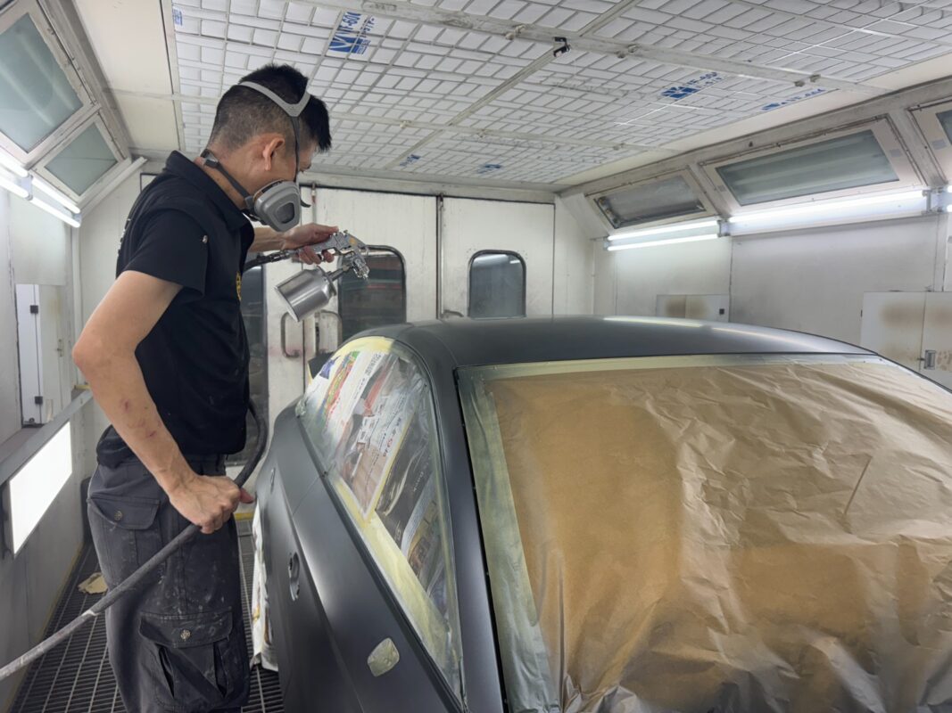 The Audi A3 after spraying, being wet-sanded back.