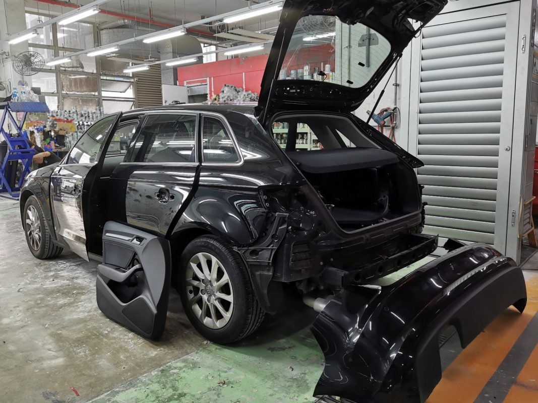 Car parts being dismantled from the A3 before spraying.