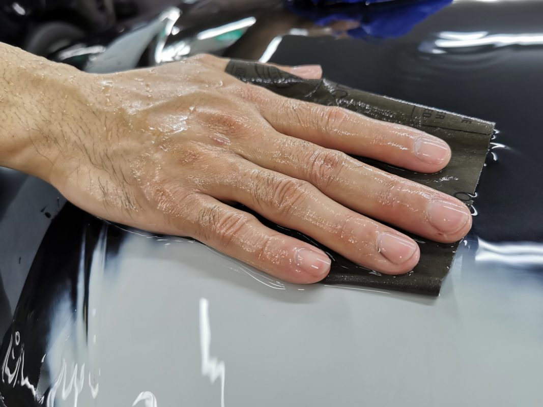 Wet-sanding the A3's panels to smooth the surface.