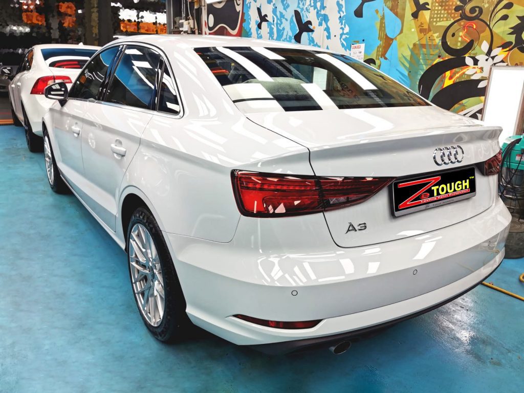 Rear quarter of the Audi A3, glossy and protected.