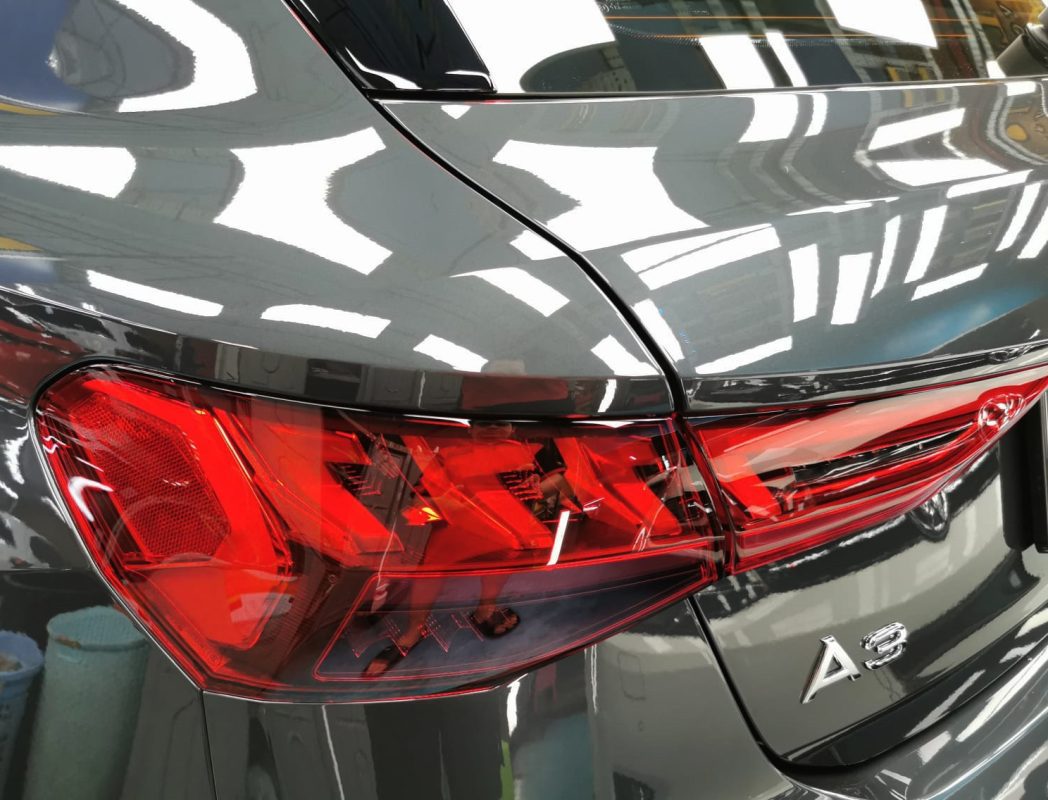 The coated bonnet of the A3 under workshop lighting.