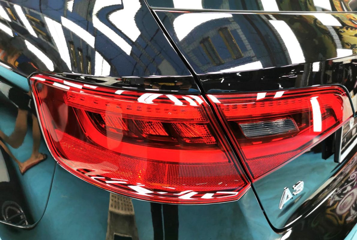 The coated bonnet of the A3 under workshop lighting.