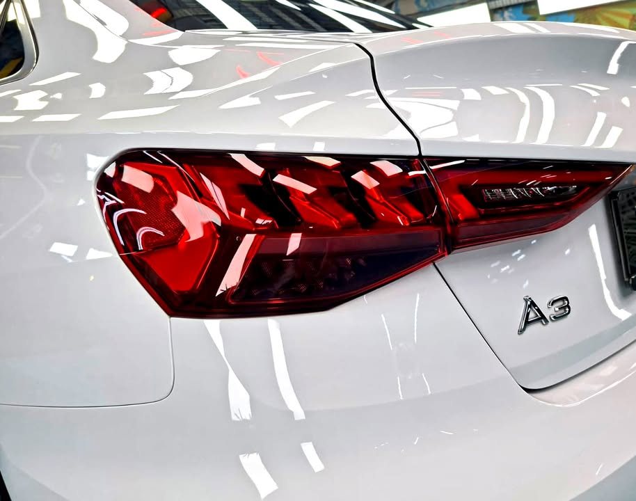 Tail light and A3 badge on the white boot lid.