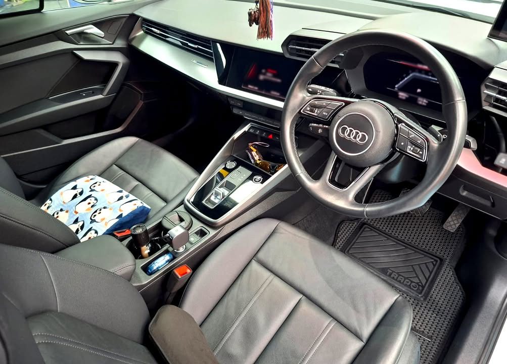 Audi A3 front cabin with grey seats and the digital dashboard.