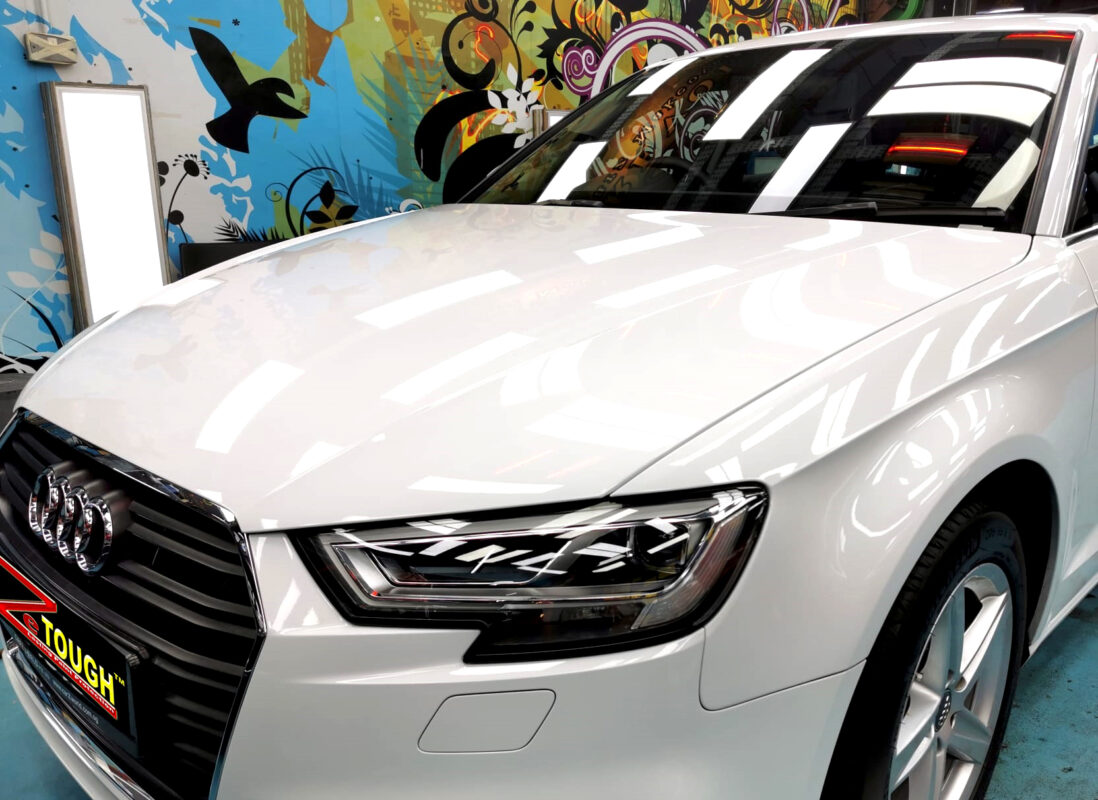 The Audi A3's coated paintwork under workshop lighting.