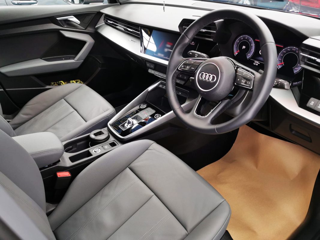 The Audi A3 parked in the workshop, freshly coated.