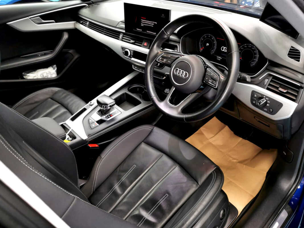 The Audi A4 parked in the workshop, freshly coated.
