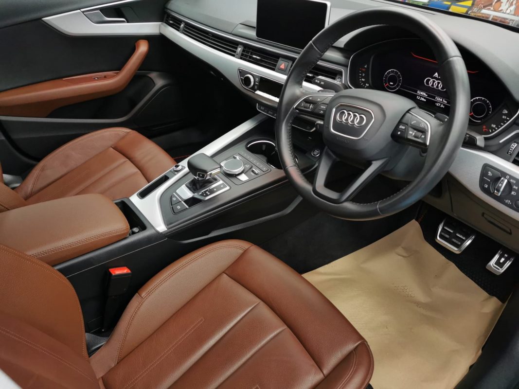 The Audi A4 parked in the workshop, freshly coated.