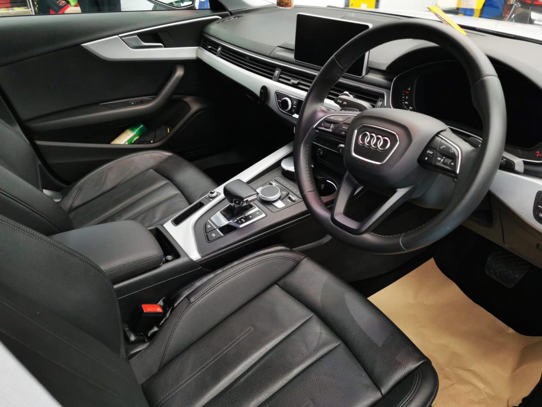 The Audi A4 parked in the workshop, freshly coated.