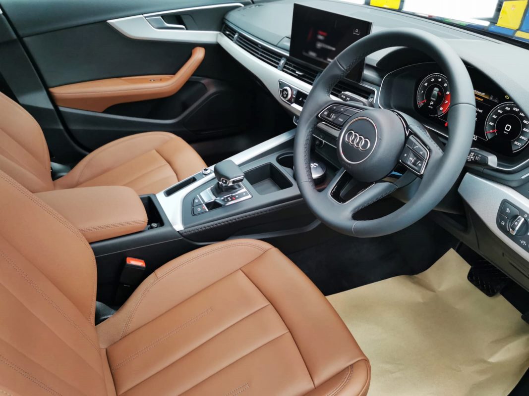 The Audi A4 parked in the workshop, freshly coated.