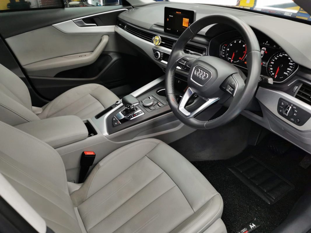 The Audi A4 parked in the workshop, freshly coated.