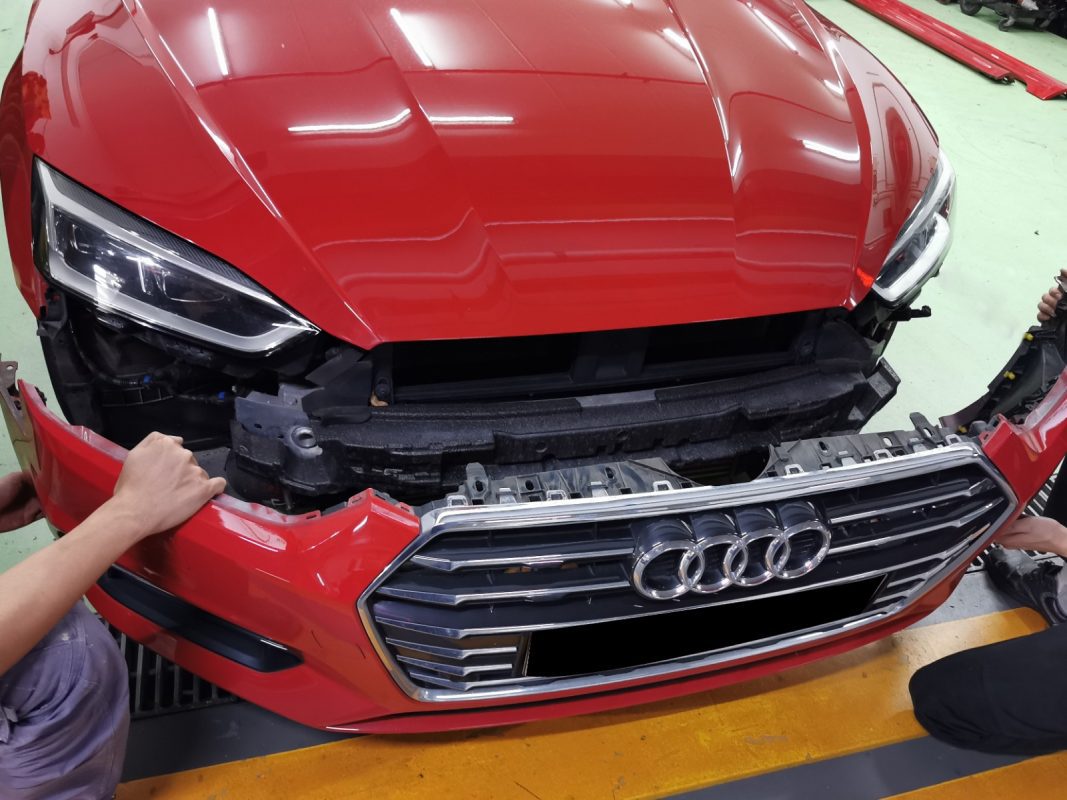 Parts being dismantled from the Audi A5 before prep work.
