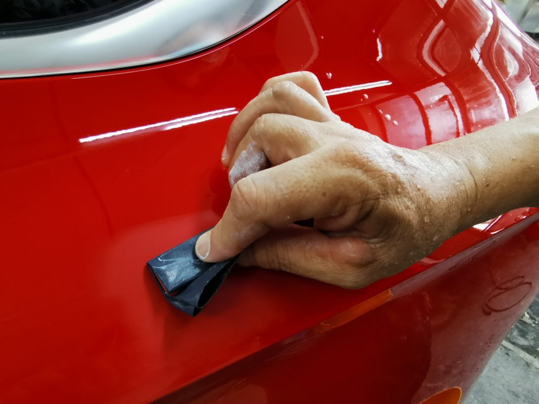 The A5 after spraying, being sanded for an even surface.