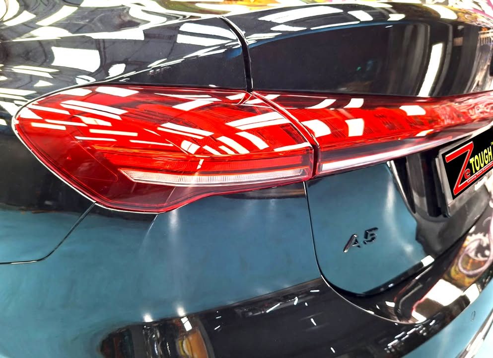 Close-up of the red rear light and A5 badge on the black boot lid.