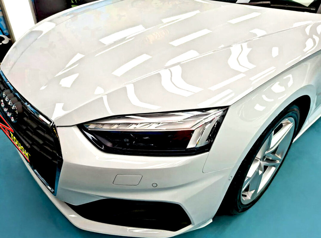 The Audi A5's coated paintwork under workshop lighting.