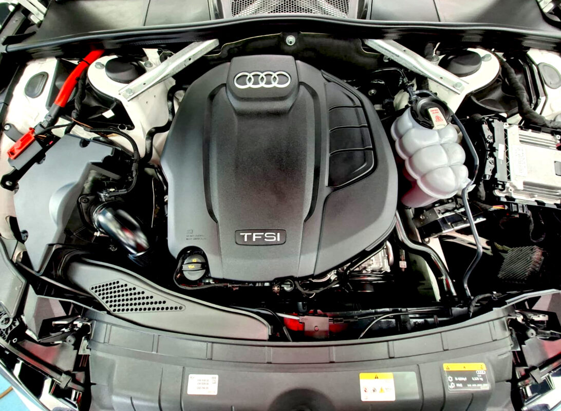 Reflections across the coated panels of the Audi A5.