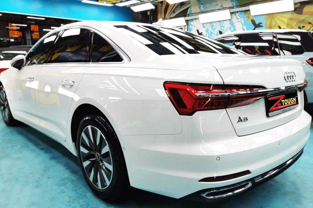 Rear quarter of the Audi A6, glossy and protected.