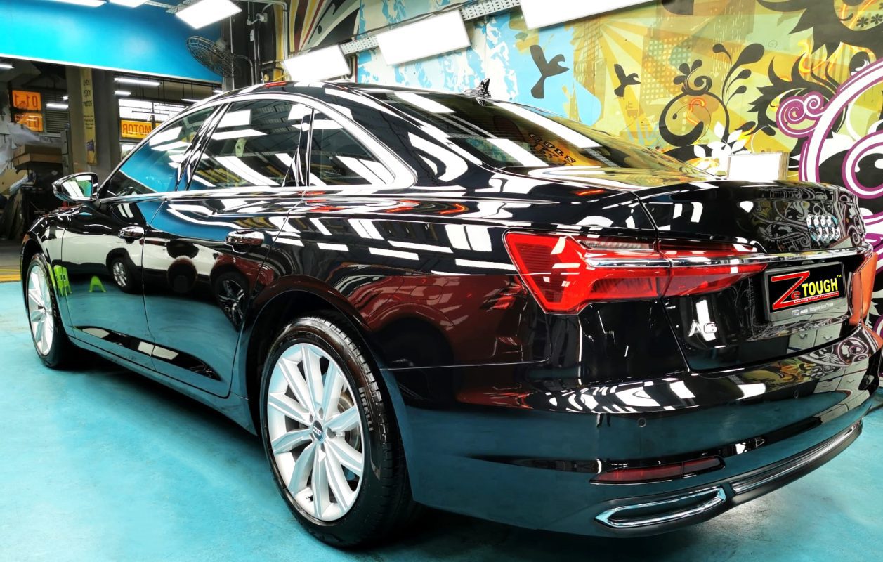 Rear quarter of the Audi A6, glossy and protected.