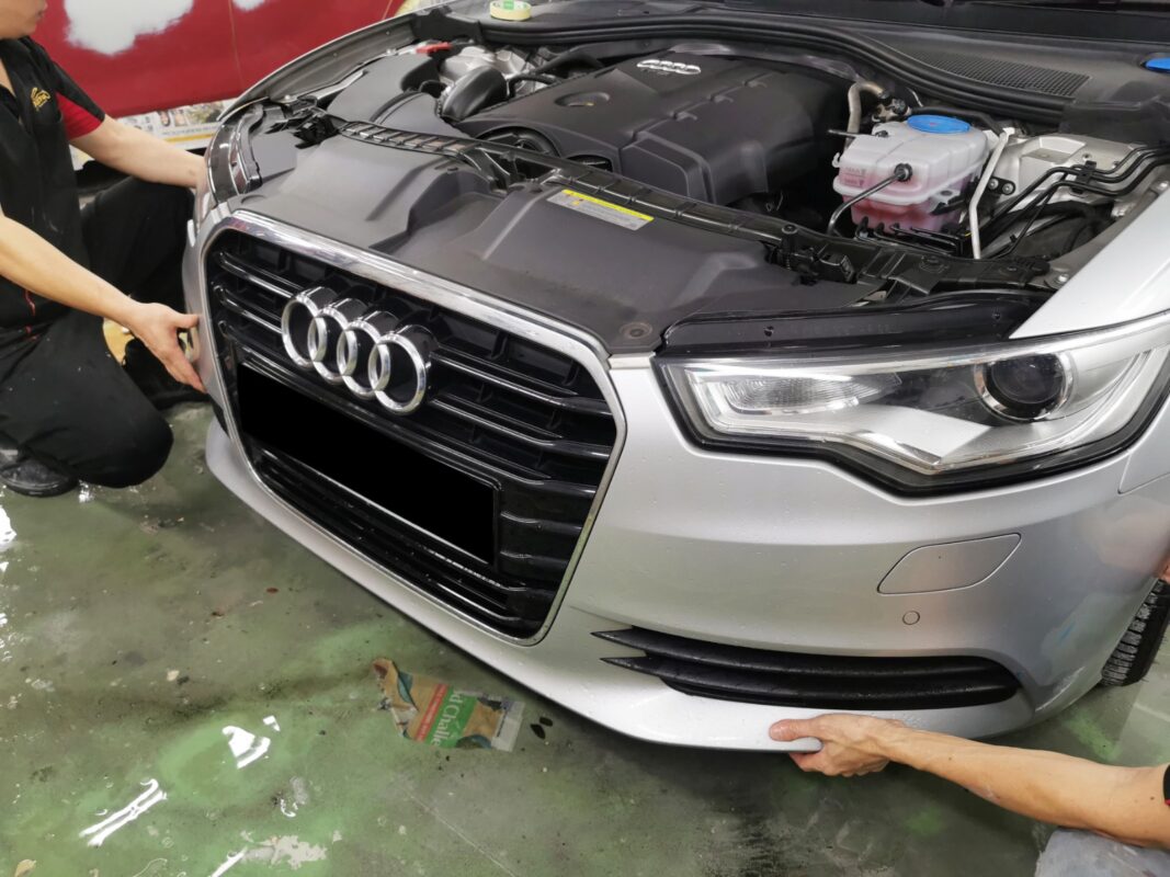 Audi A6 with parts being removed at the start of the strip-down process.