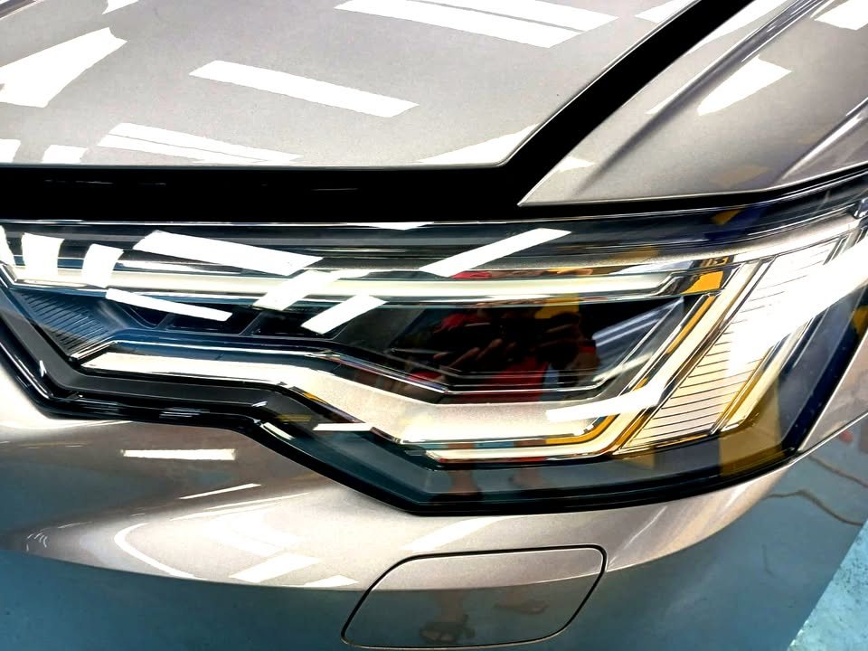Close-up of the Audi A6 LED headlamp.