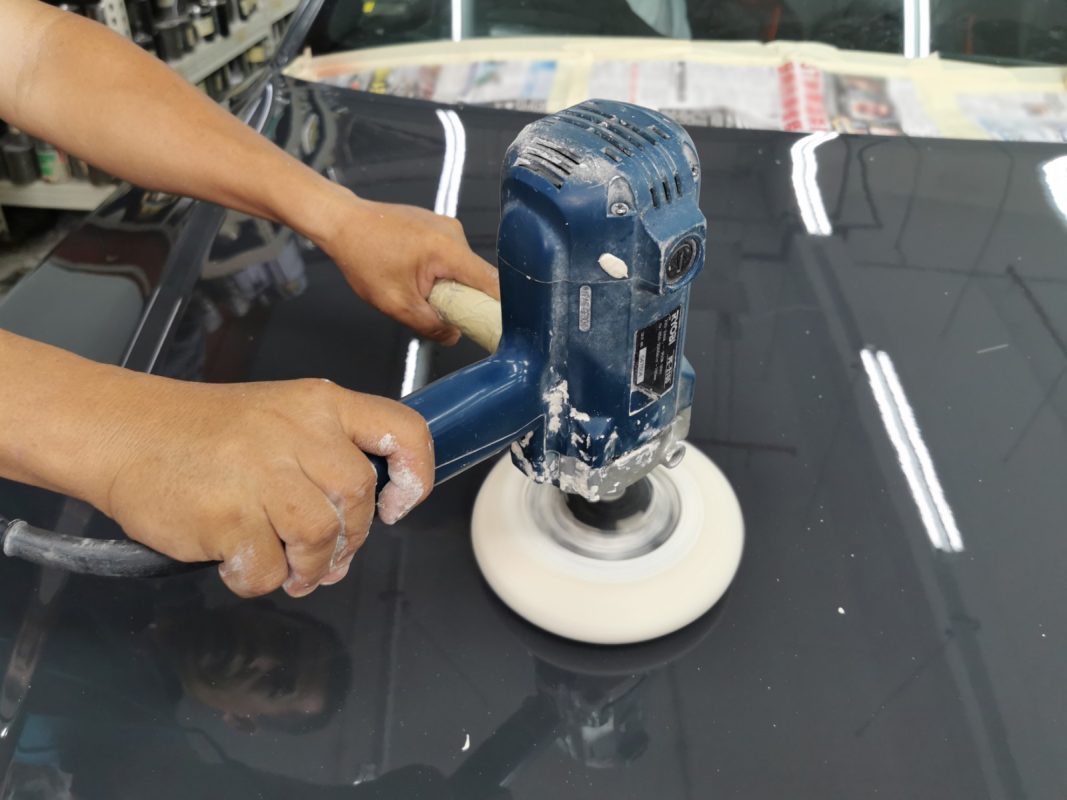 The A7 being wet-sanded again after spraying for an even surface.