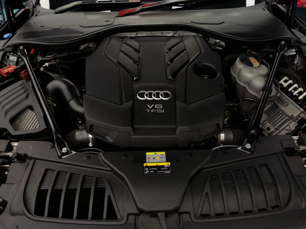 Reflections across the coated panels of the Audi A8.