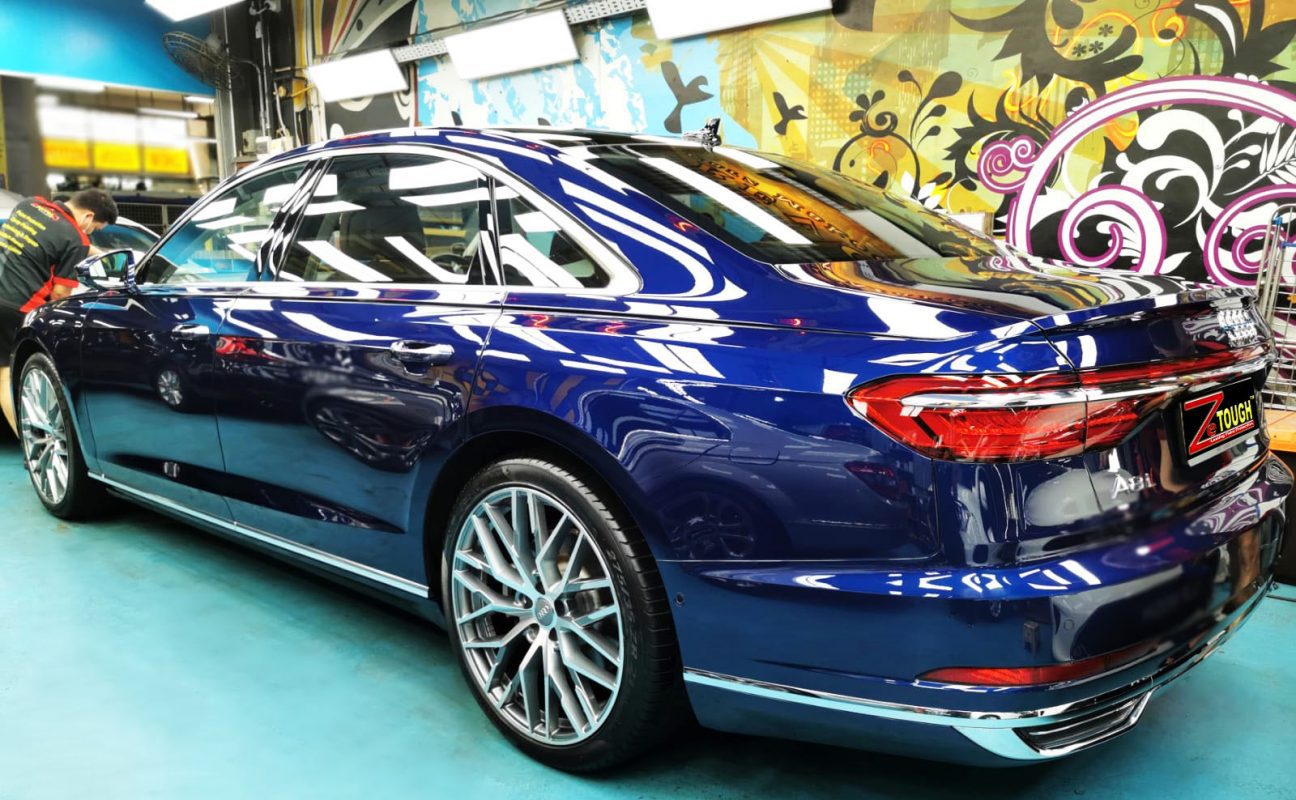 Rear quarter of the Audi A8L, glossy and protected.