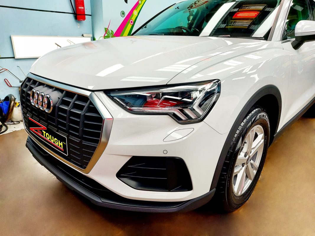 Side view of one of the Audis, freshly coated.