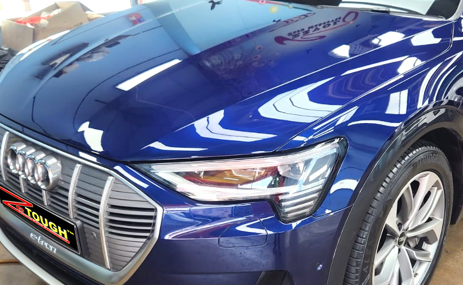 The Audi e-tron from a side angle after the ceramic coating.