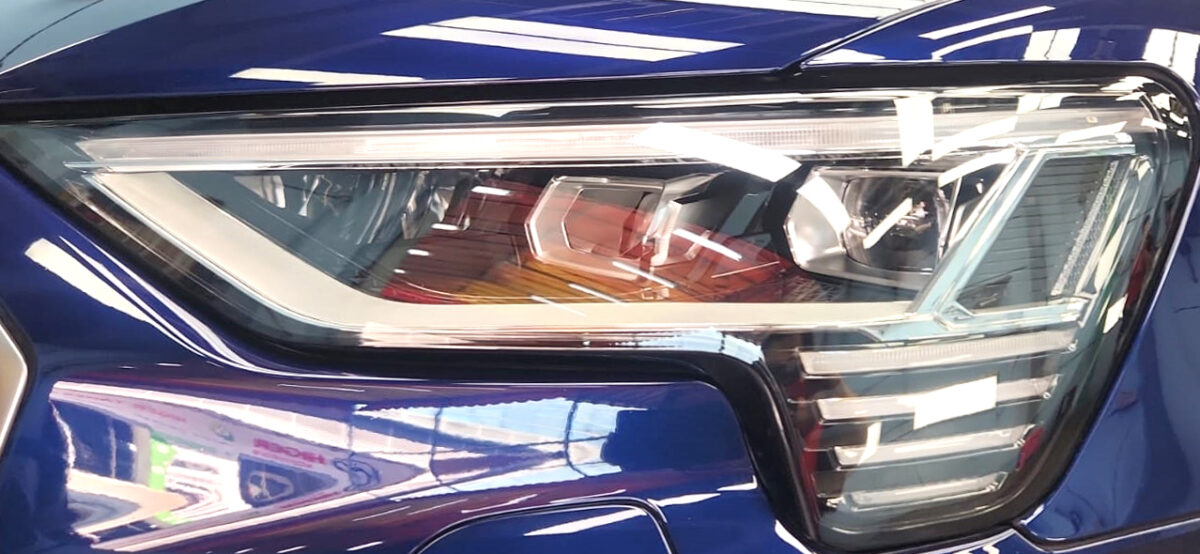 The e-tron's coated paintwork showing clean reflections.